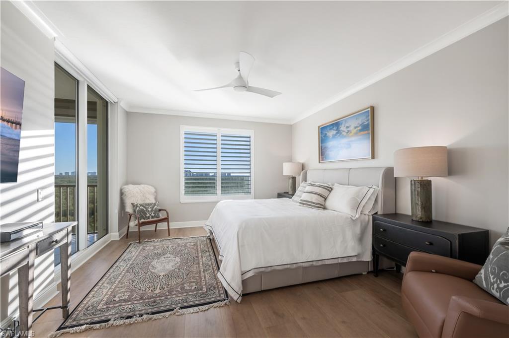 Bedroom featuring ceiling fan, wood-type flooring, and crown molding