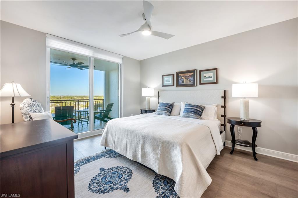Bedroom with access to outside, light hardwood / wood-style flooring, and ceiling fan