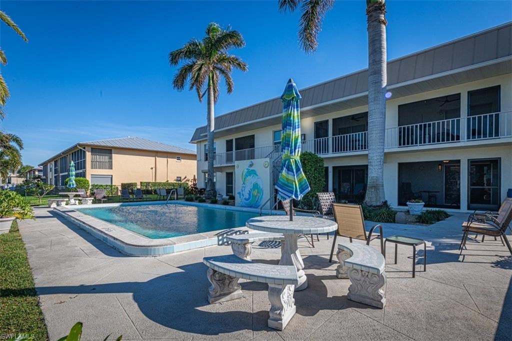 View of pool with a patio area
