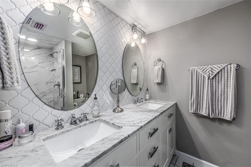 Bathroom with vanity and walk in shower