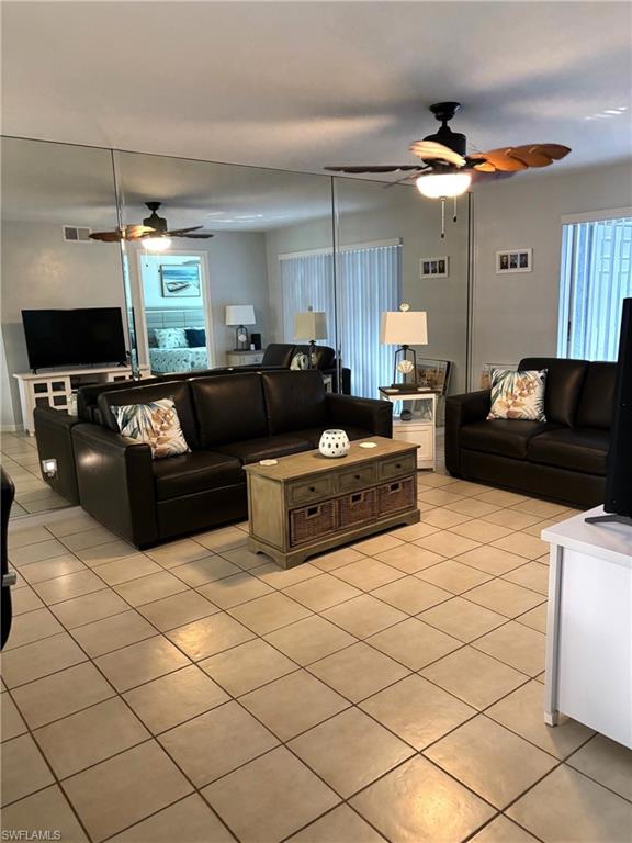 Living room featuring light tile patterned floors