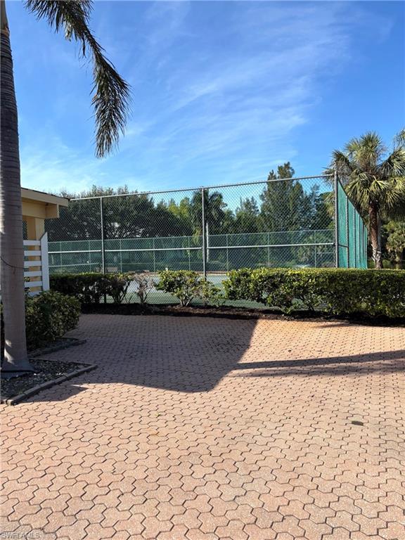 Surrounding community with tennis court
