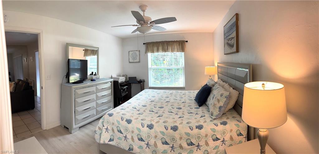 Bedroom featuring ceiling fan and light hardwood / wood-style floors