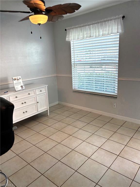 Unfurnished bedroom with ceiling fan