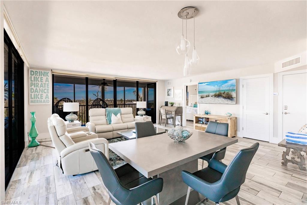Dining room featuring expansive windows and light hardwood / wood-style floors