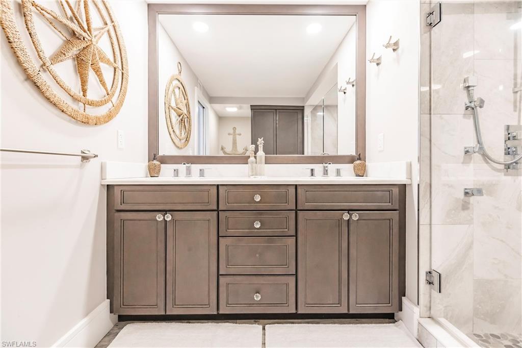 Bathroom with vanity and walk in shower