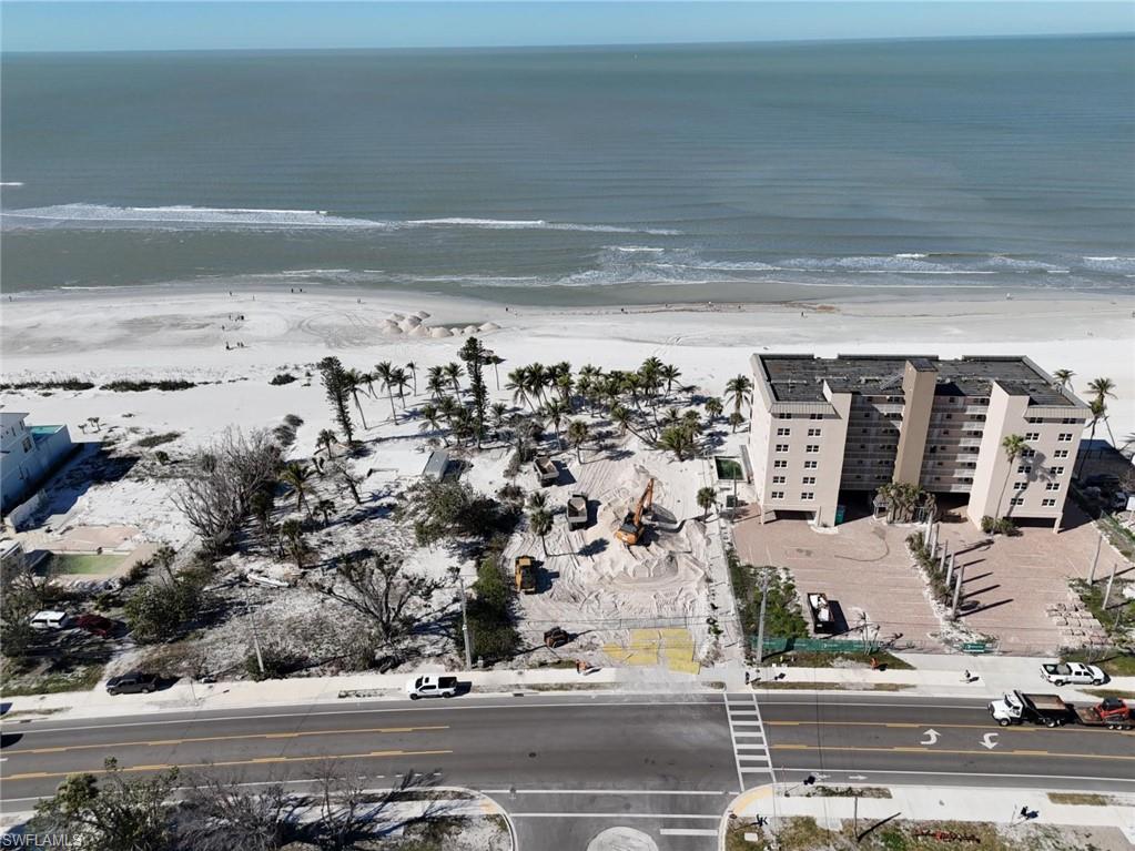 Aerial view of property's location featuring a large body of water