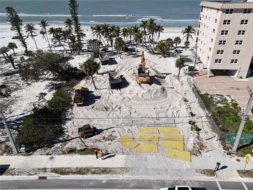Drone / aerial view of waterfront with a beach