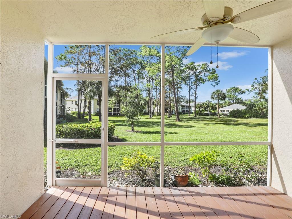 Unfurnished sunroom with ceiling fan