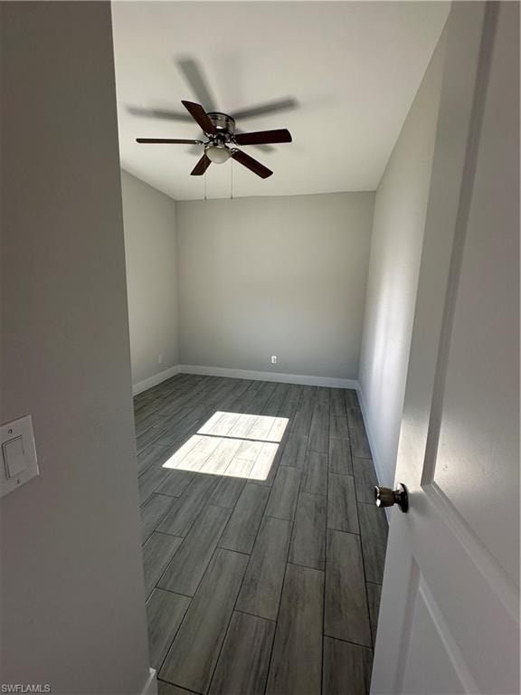 Unfurnished room featuring hardwood / wood-style floors and ceiling fan