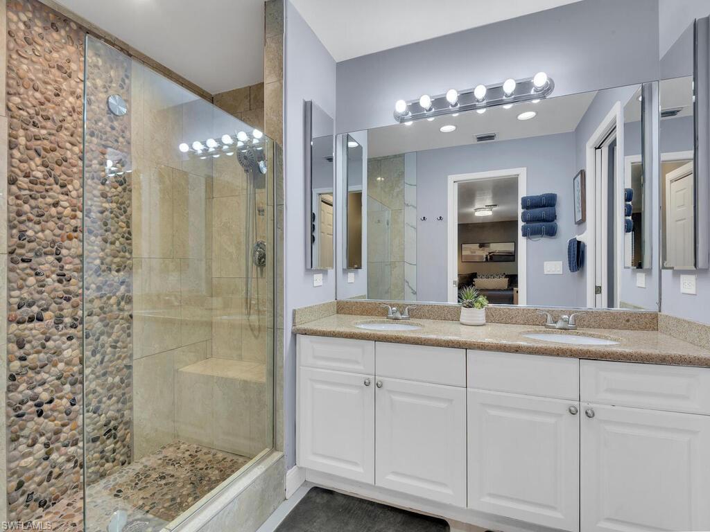 Bathroom featuring vanity and walk in shower