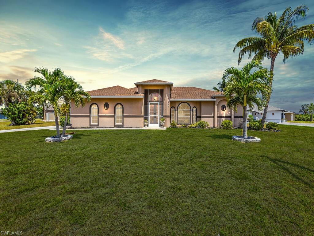 Mediterranean / spanish house with a lawn