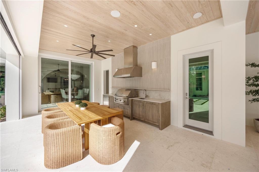 Dining area featuring ceiling fan and wood ceiling