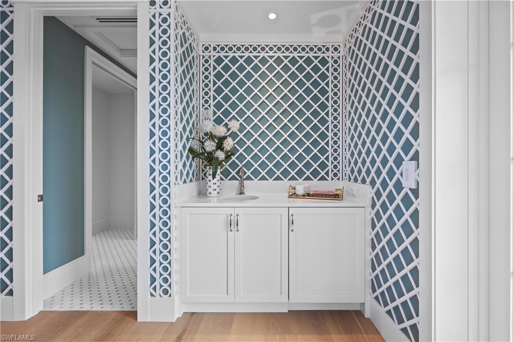 Bathroom with hardwood / wood-style floors and vanity