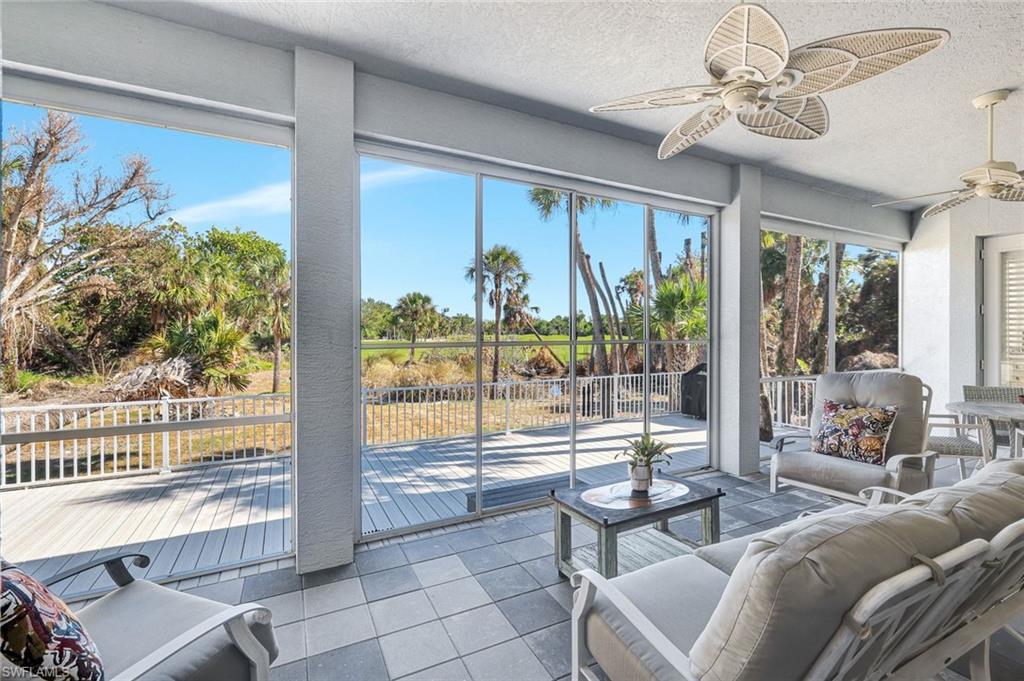 Screened-in lanai featuring ceiling fan