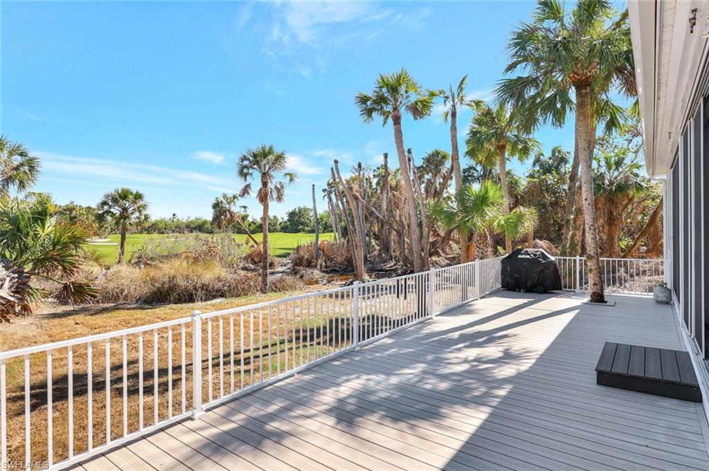 Deck with area for grilling & viewing of the golf course and birds