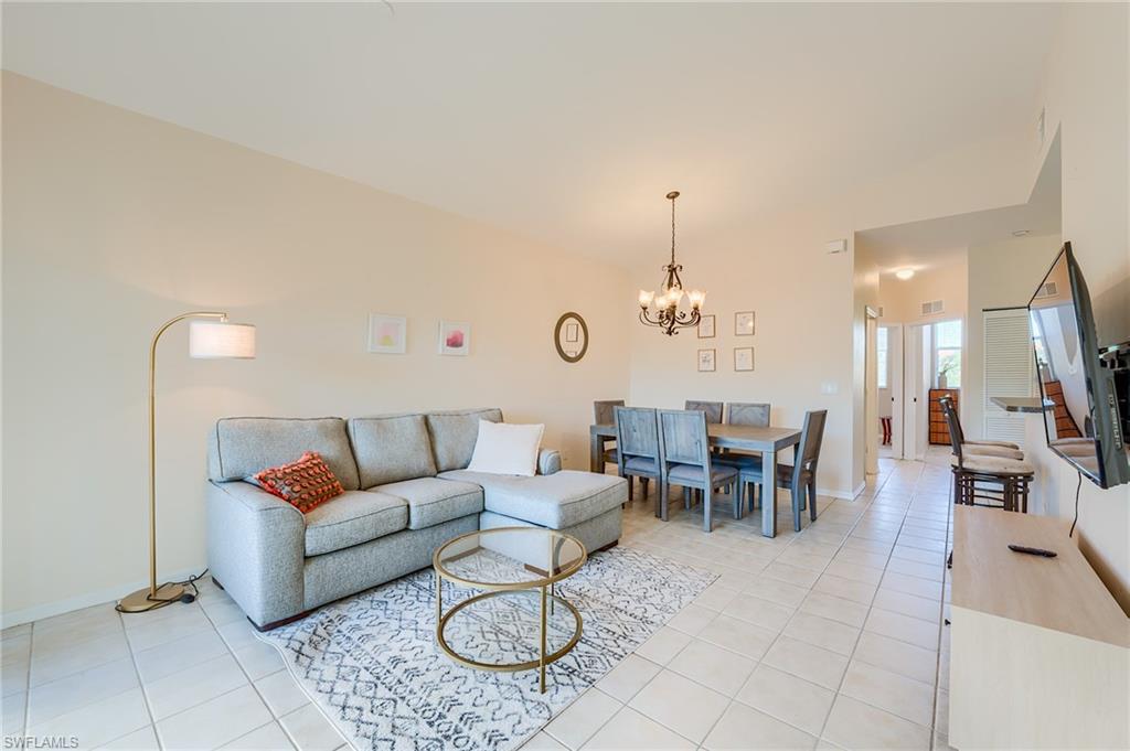 Living room featuring a chandelier and light tile patterned floors