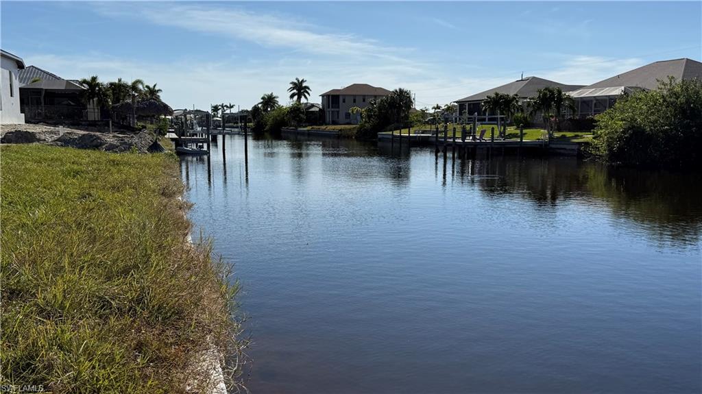Property view of water featuring a boat dock