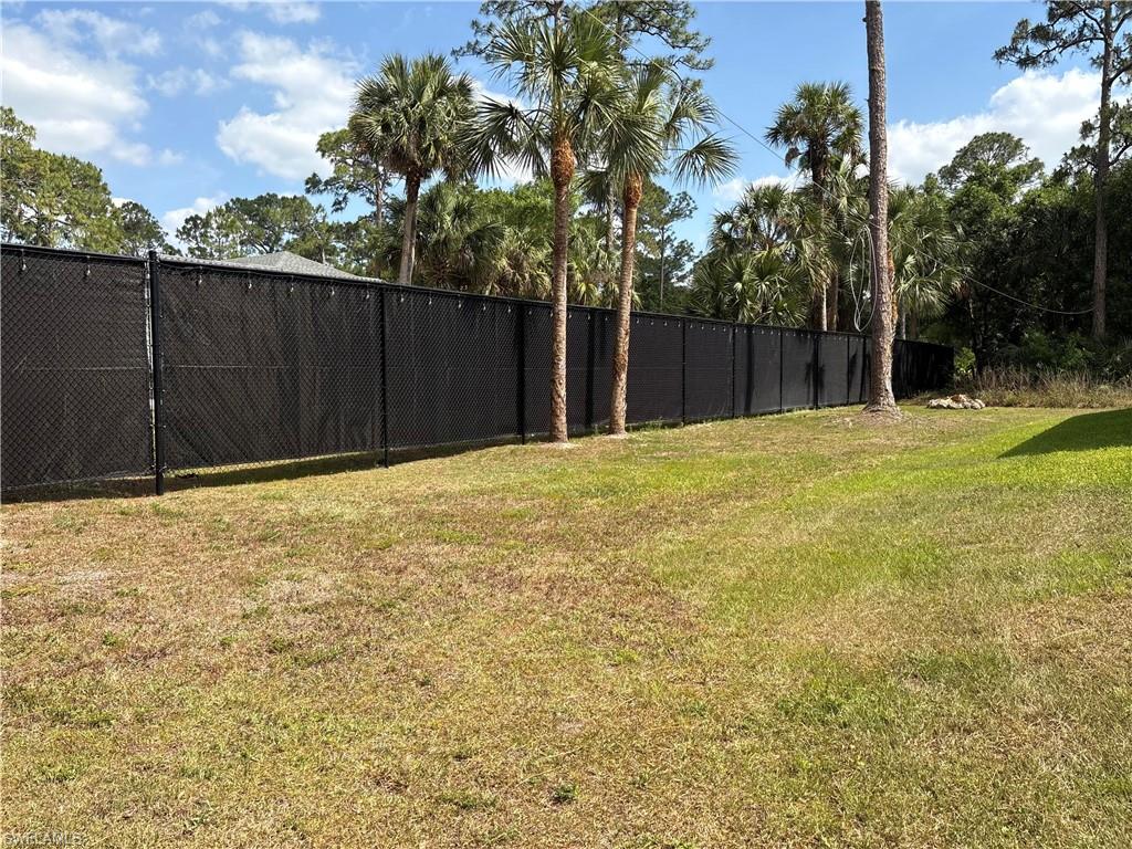 View of yard featuring fence
