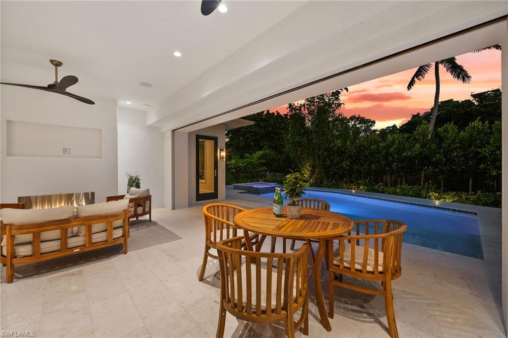 Cozy fireplace next to outdoor dining area