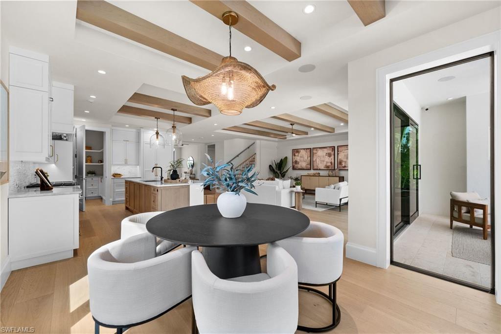 Bright dining area next to kitchen and outdoor grill area