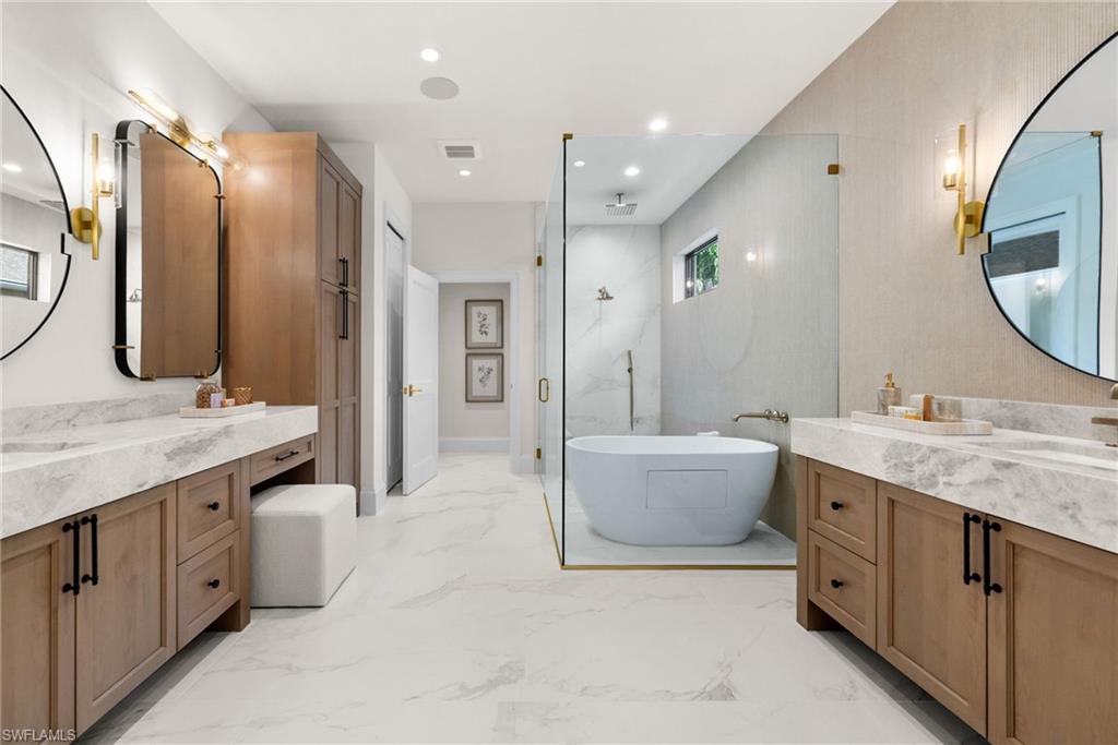 Master bathroom glass enclosed water room with shower|jacuzzi tub