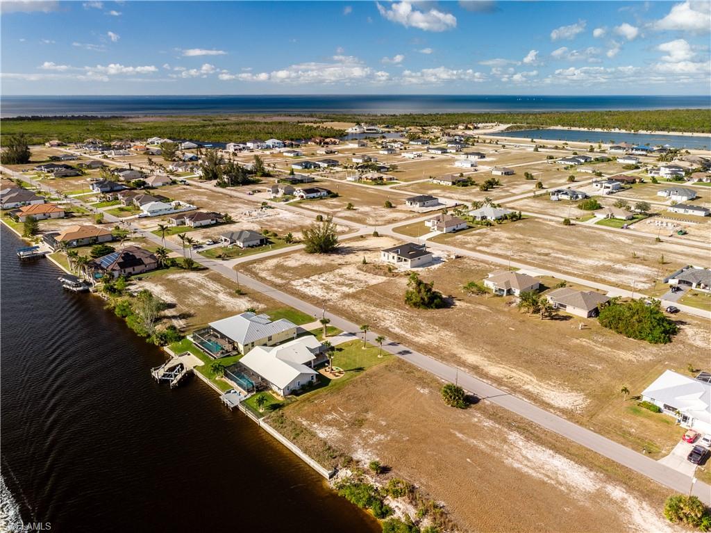 Aerial view of the property and surrounding area