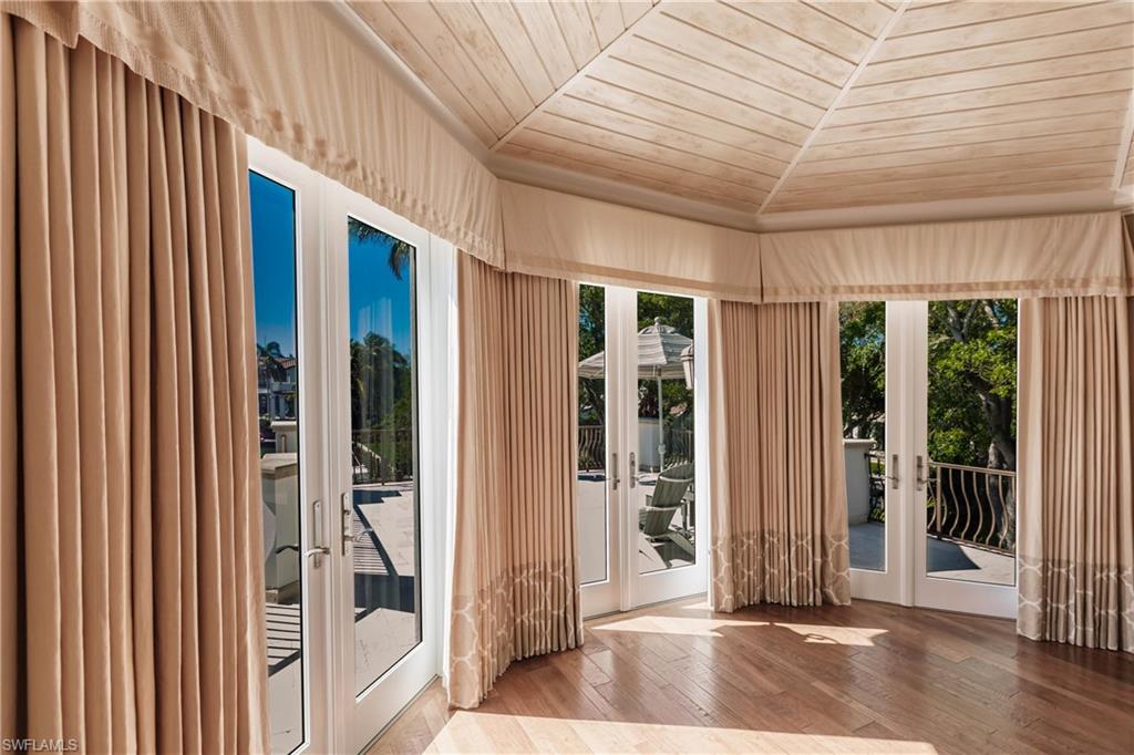 Entryway featuring hardwood / wood-style floors, wood ceiling, and french doors