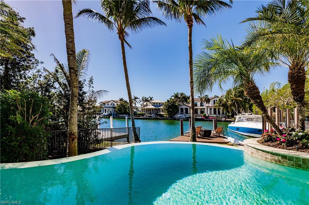 View of swimming pool featuring a water view