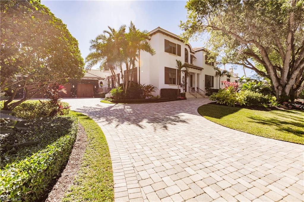 Mediterranean / spanish-style house with a front yard