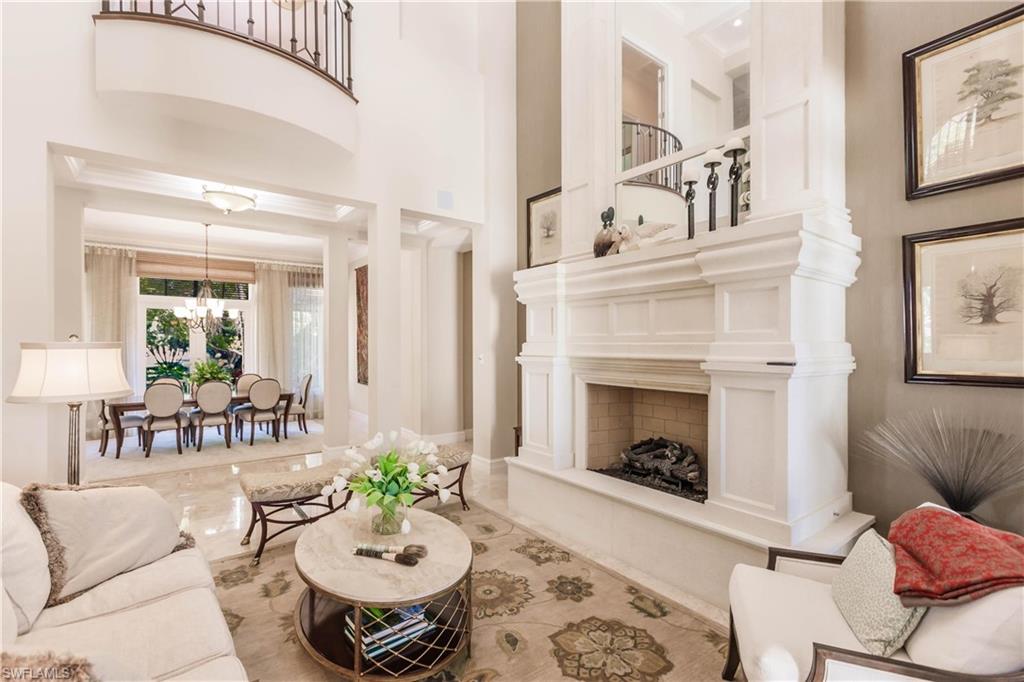 Living room with an inviting chandelier and a high ceiling