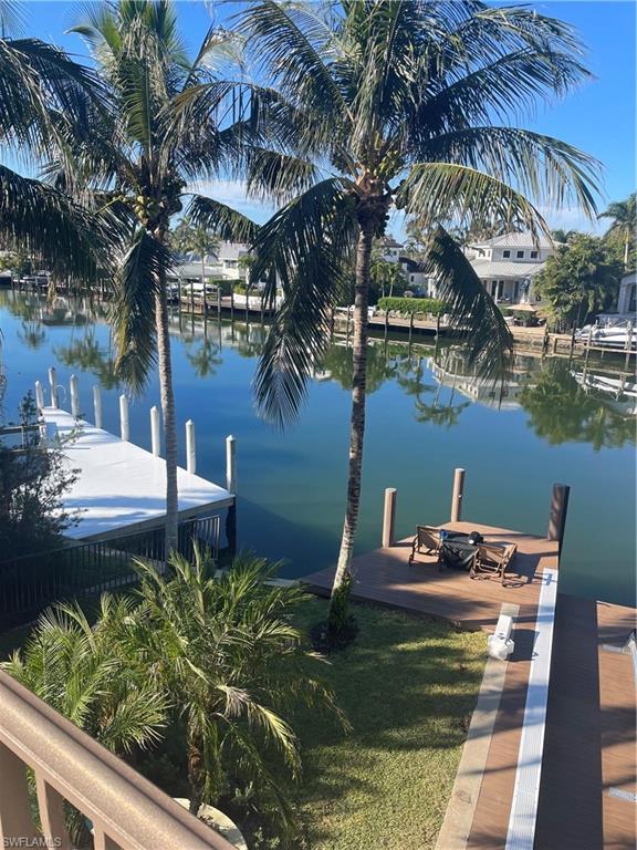 Dock area featuring a water view