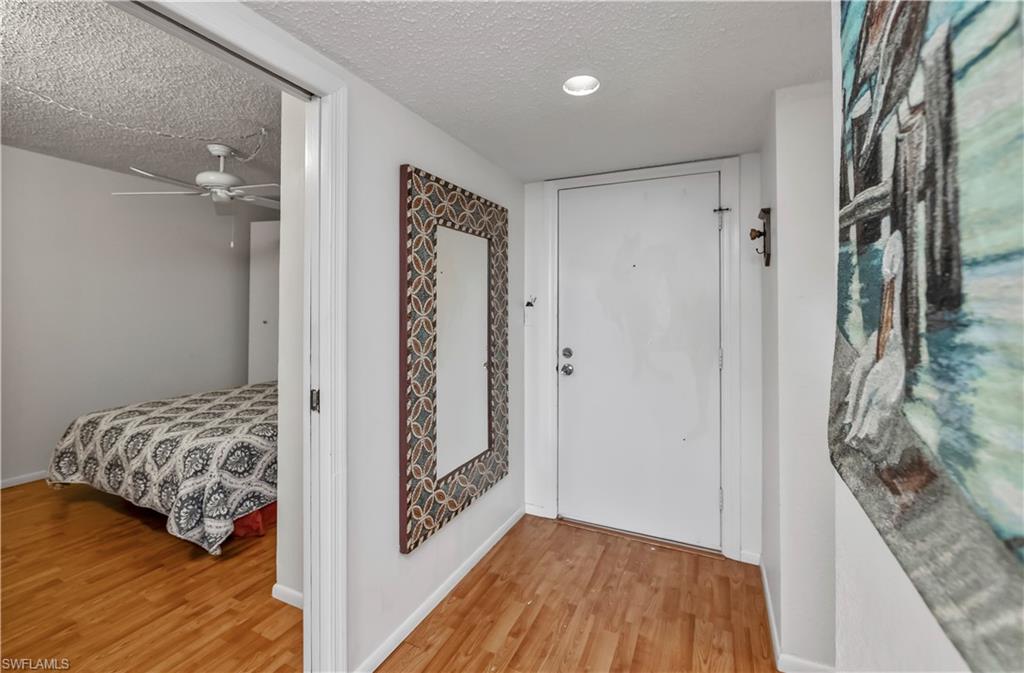 Primary bedroom closet walk in with extra storage closet