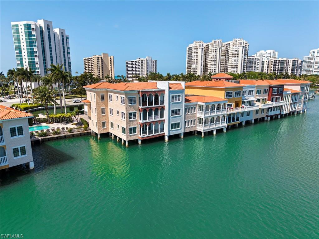 View of urban area featuring a nearby body of water