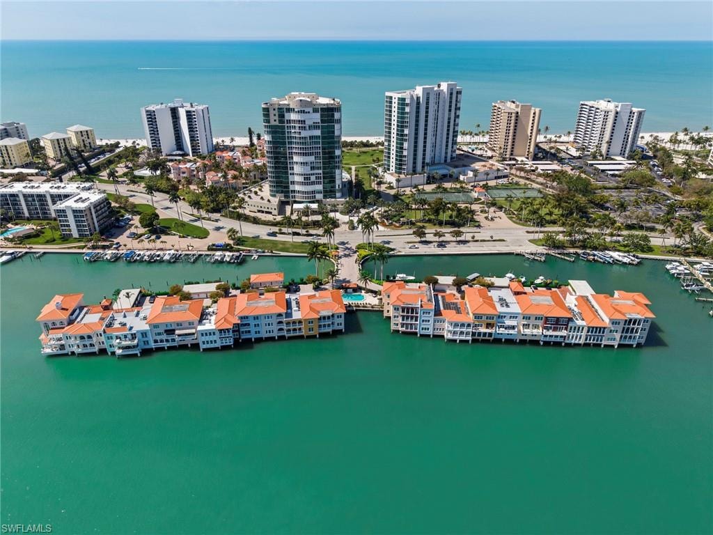 View of urban area featuring numerous boat docks and a nearby body of water