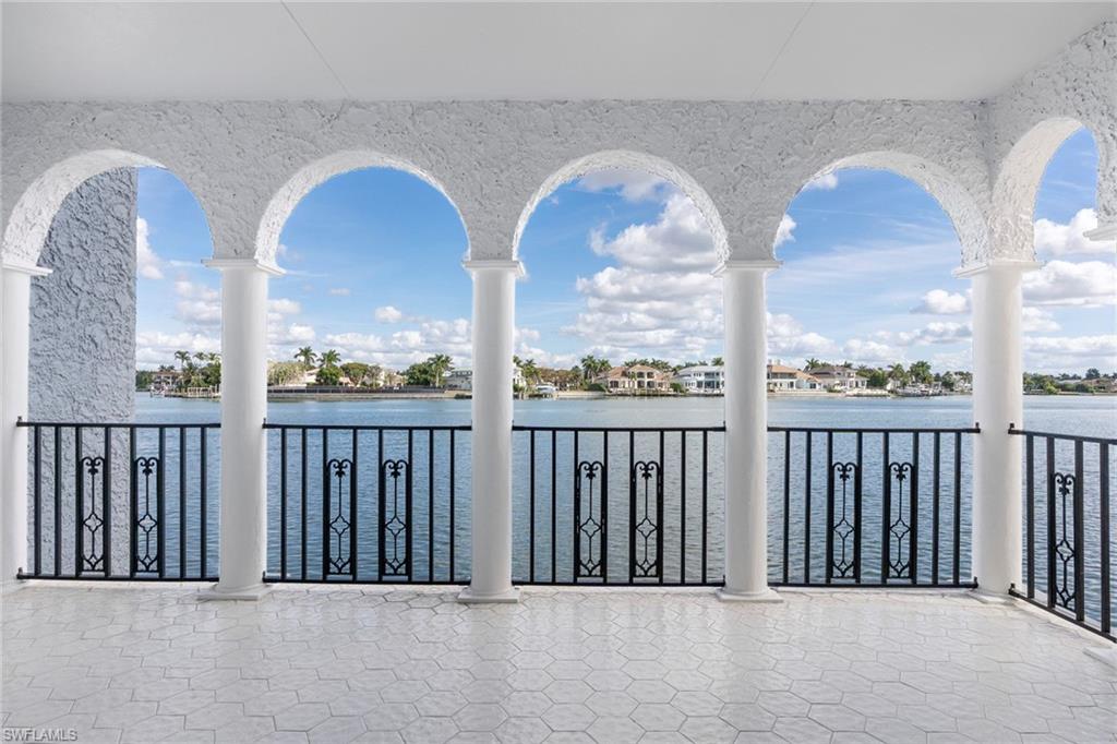 View of patio with a water view