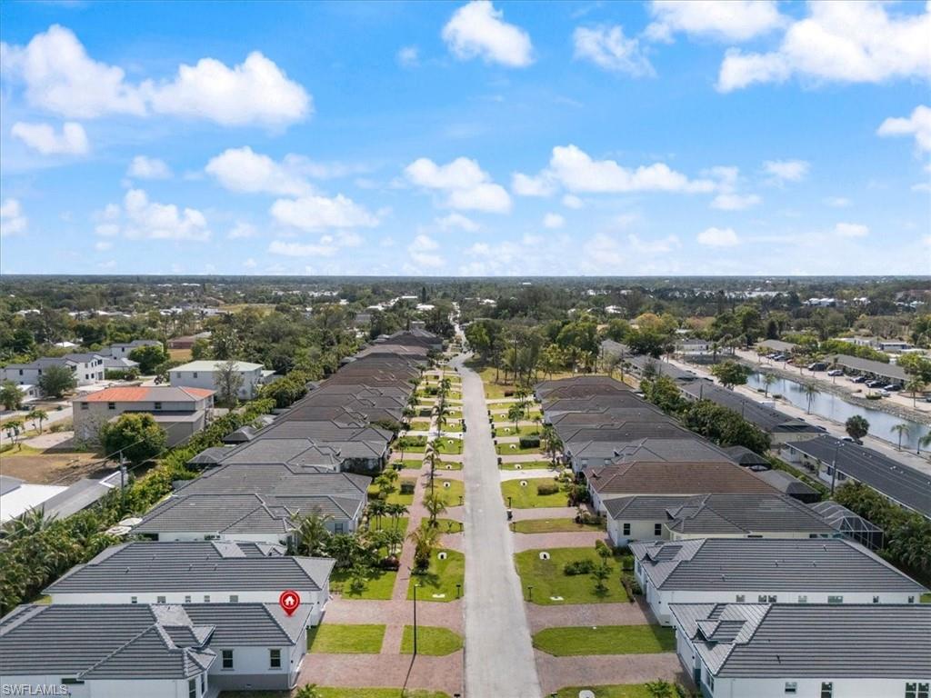 Bird's eye view featuring a water view and a residential view