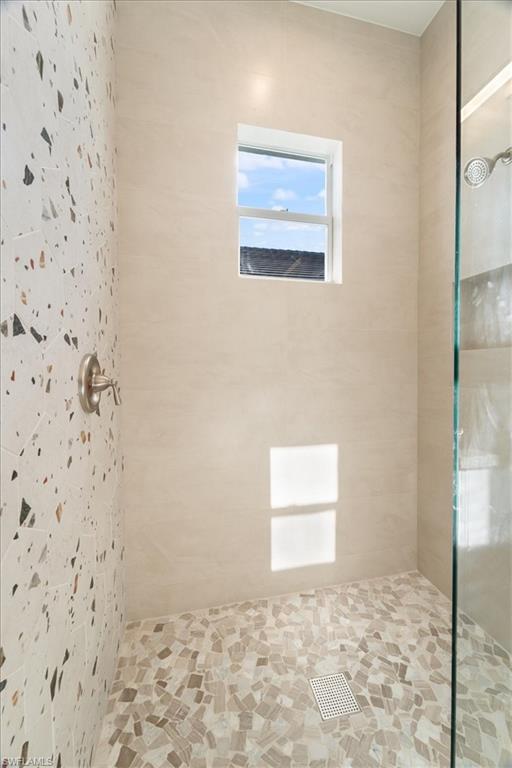 Full bath with tiled shower