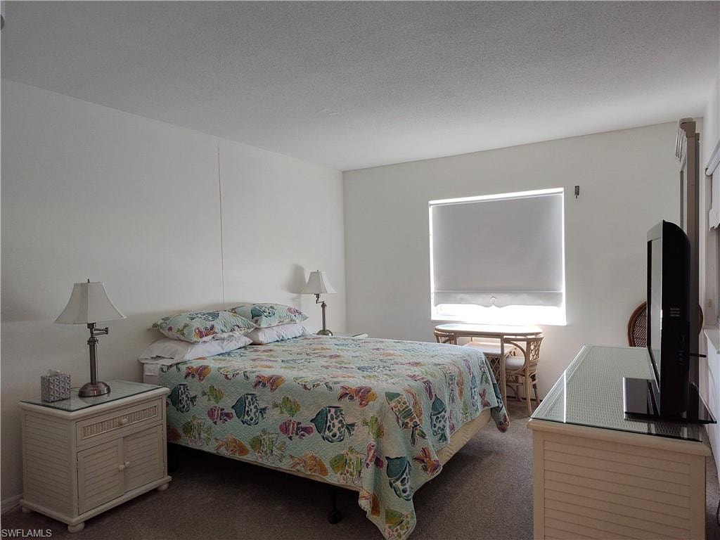 Bedroom featuring carpet floors