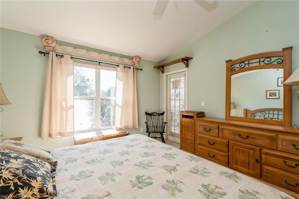 Bedroom featuring vaulted ceiling and ceiling fan