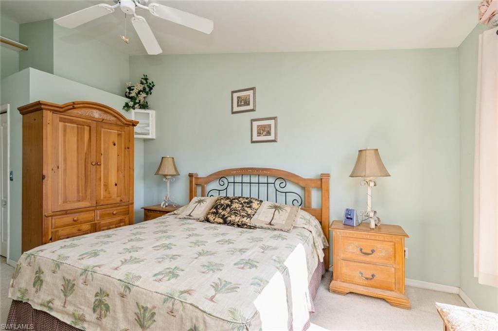 Carpeted bedroom with ceiling fan