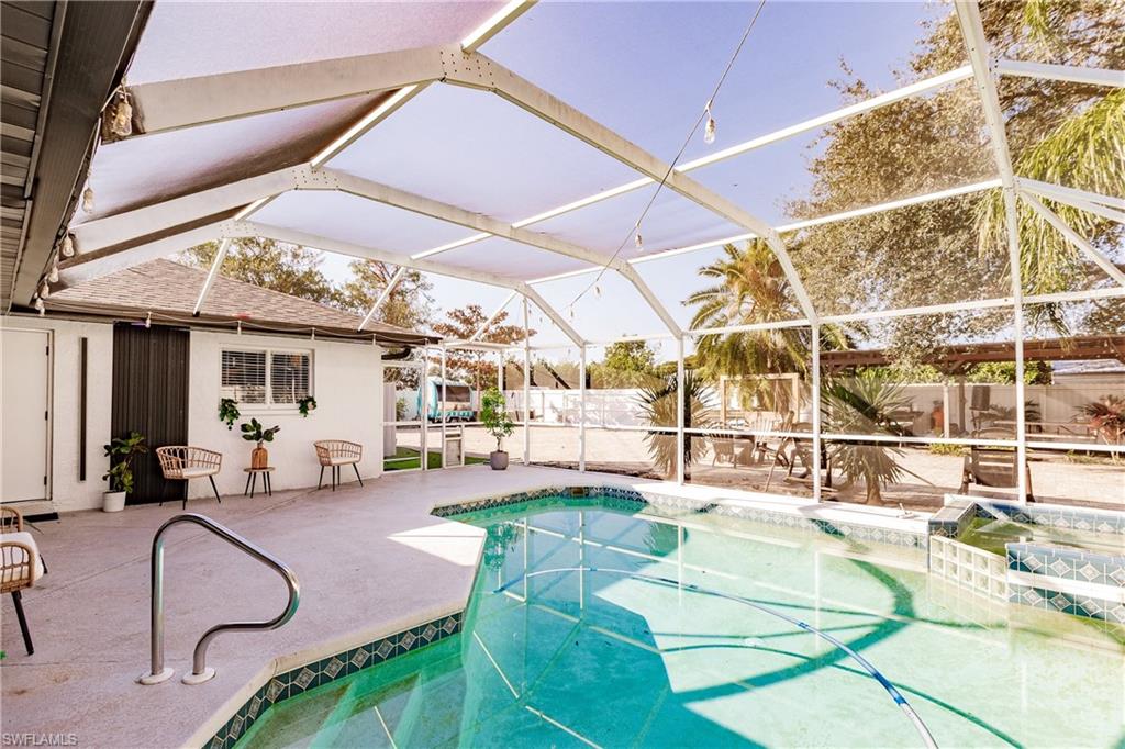View of pool featuring a lanai and a patio