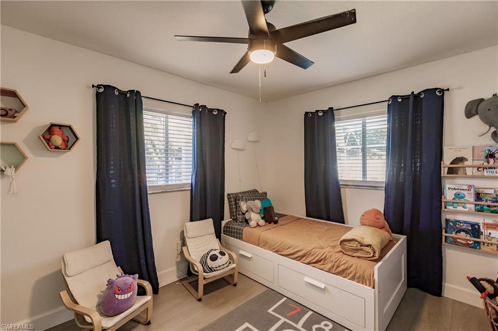 Bedroom featuring ceiling fan and light wood-type flooring