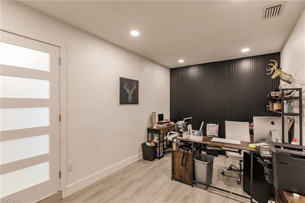 Office space featuring light hardwood / wood-style floors