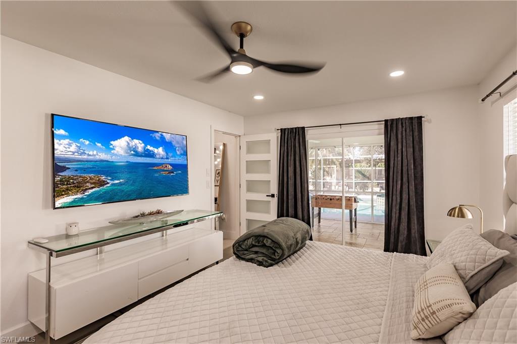 Bedroom featuring ceiling fan and access to exterior