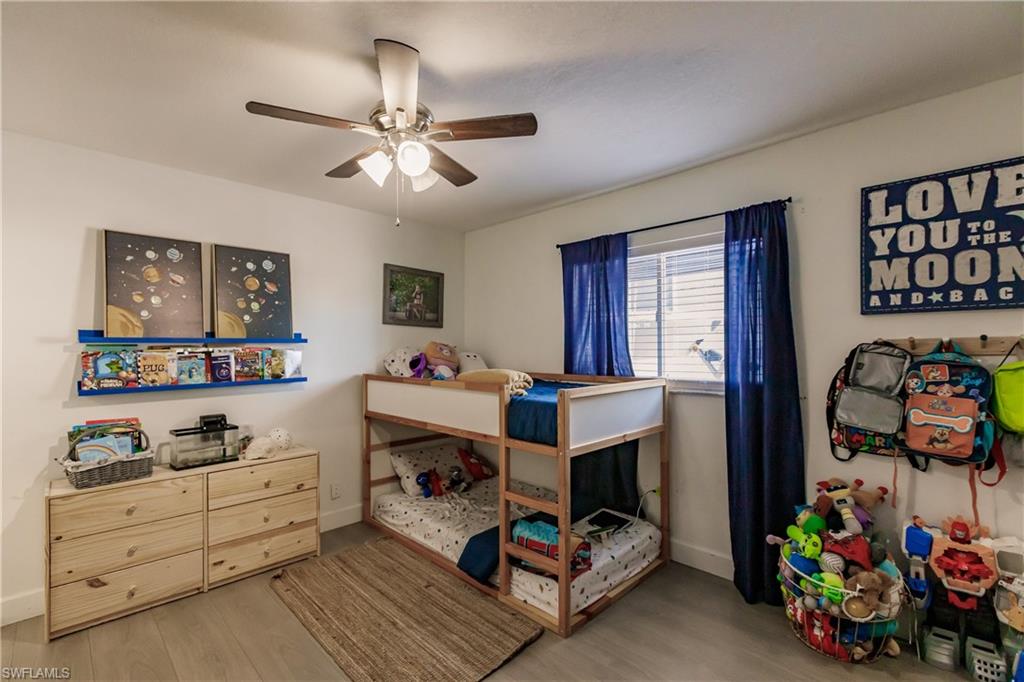 Bedroom featuring ceiling fan and light wood-type flooring
