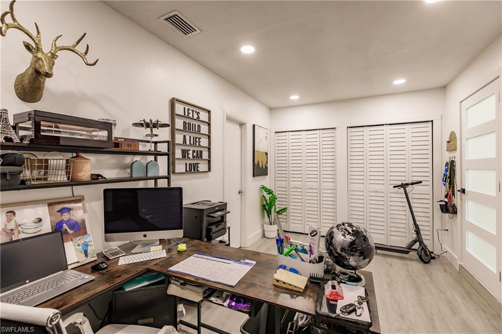 Office space featuring light hardwood / wood-style floors