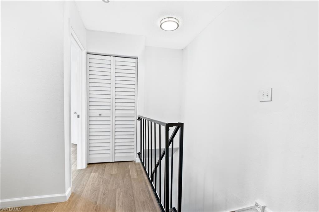 Hall featuring light wood-type flooring