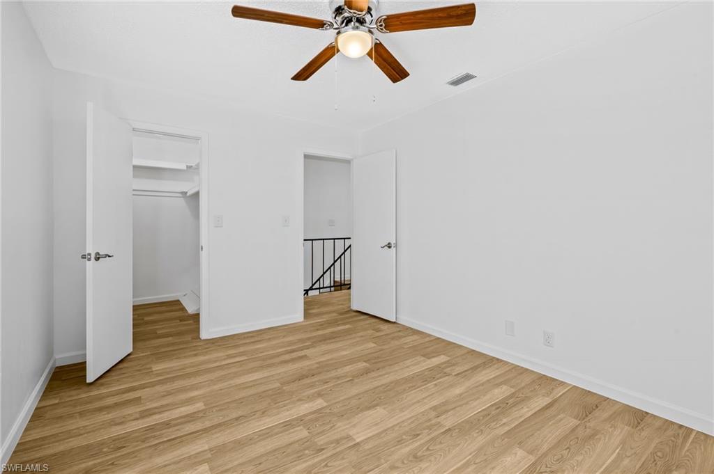 Unfurnished bedroom featuring ceiling fan and light hardwood / wood-style floors