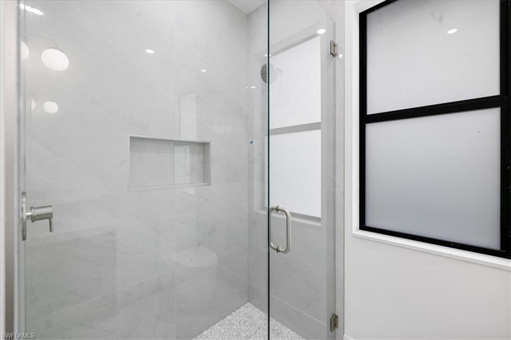 Bathroom featuring a shower with shower door
